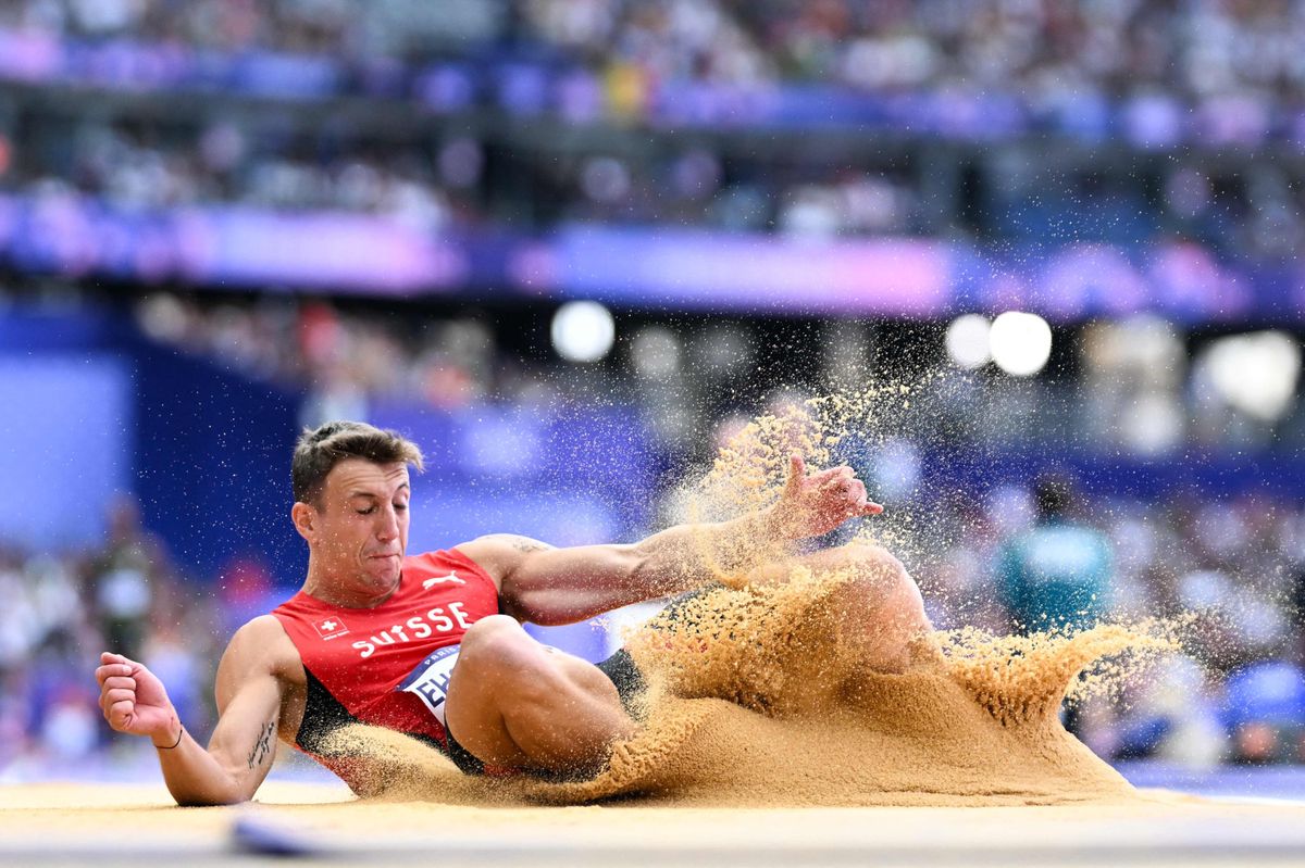 Switzerland's Simon Ehammer competes in the men's long jump qualification of the athletics event at the Paris 2024 Olympic Games at Stade de France in Saint-Denis, north of Paris, on August 4, 2024. (Photo by Kirill KUDRYAVTSEV / AFP)