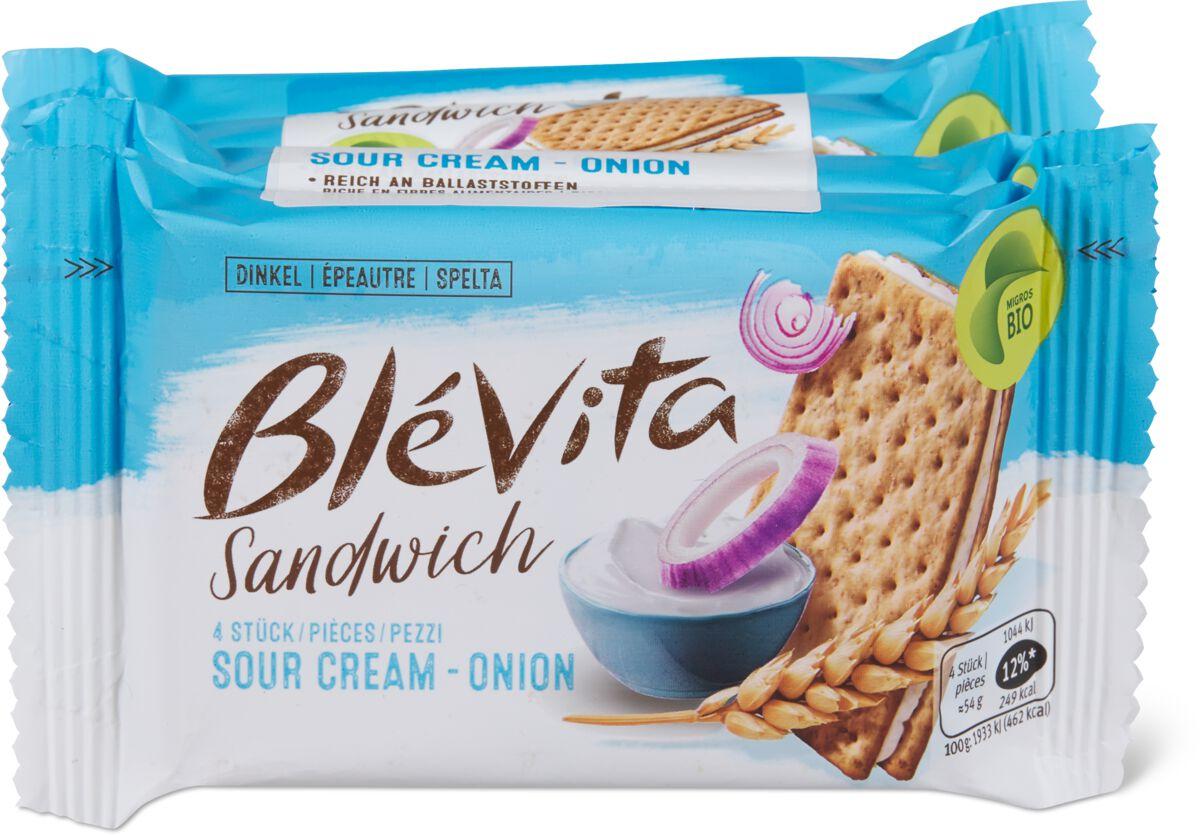 Paquet de sandwiches Blévita au goût crème sure et oignon, avec illustration de crackers d'épeautre et bol de sauce.