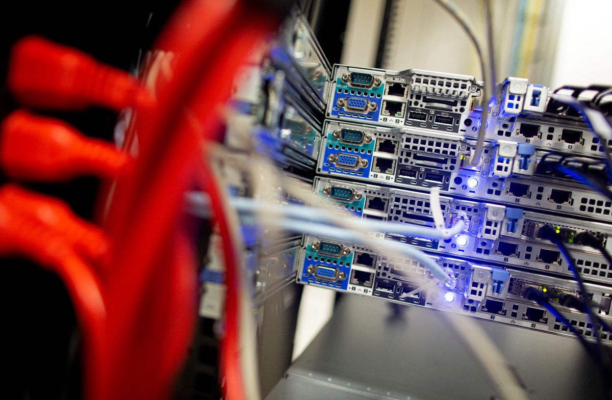 Cables link servers in carefully controlled environments inside Servecentric Data Centre on the outskirts of Dublin in Ireland on December 10, 2018. Fortunes are being made in clusters of anonymous warehouses outside Dublin that contain vast data centres driving the digital boom of a fourth industrial revolution. (Photo by PAUL FAITH / AFP)