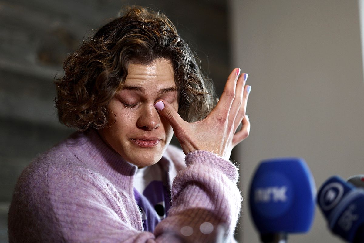 Norway's Lucas Braathen wipes his tears during a press conference in Soelden, Austria, Friday, Oct. 27, 2023. (AP Photo/Gabriele Facciotti)