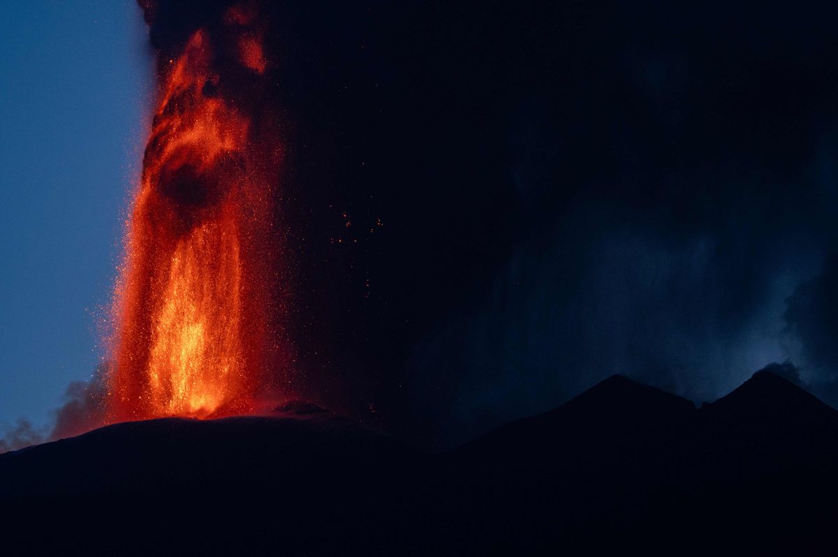 Lava pours out of Mount Etna.