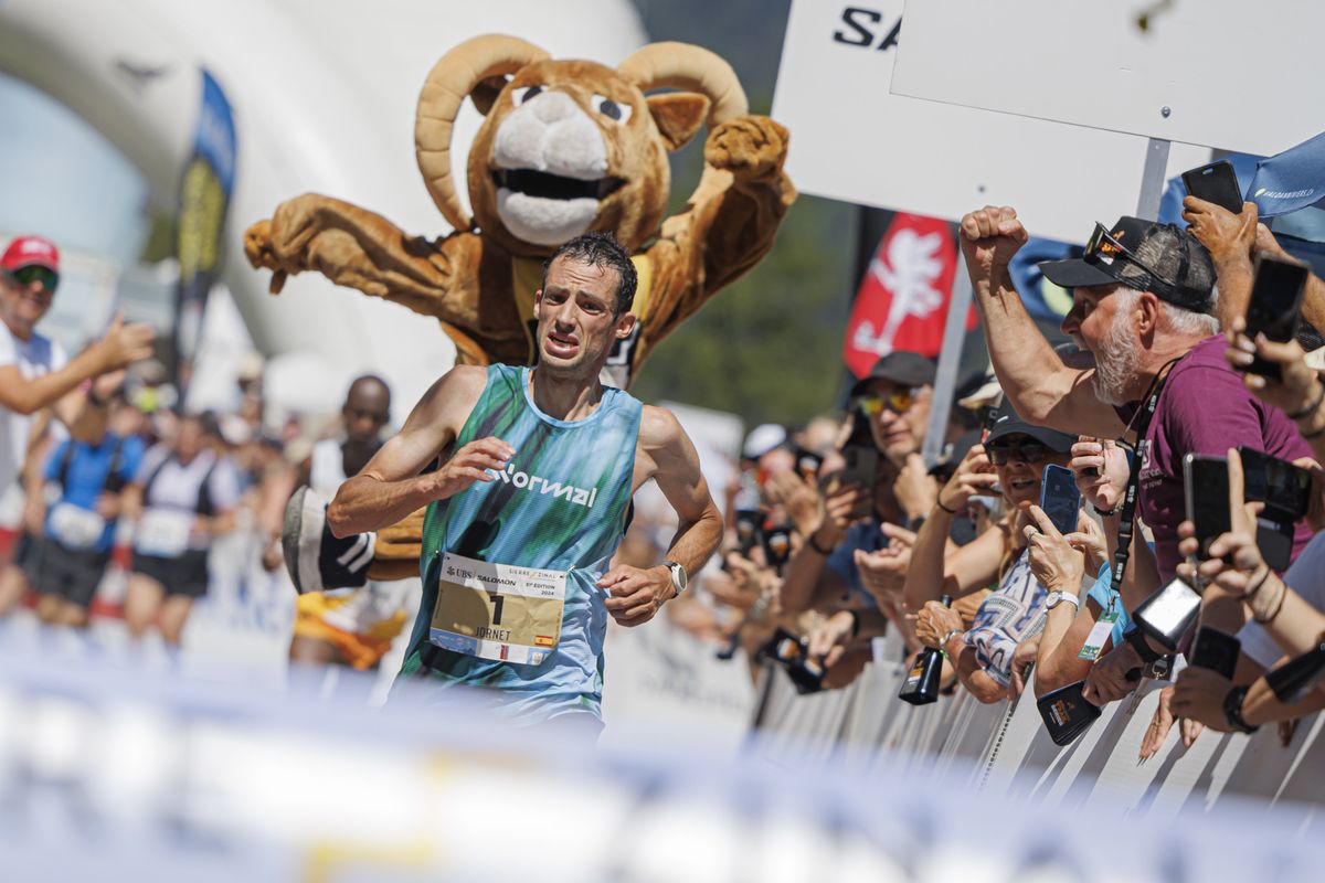 Kilian Jornet from Spain races towards the finish line to win the men's category and establish a new race record during the 51st Sierre-Zinal long distance mountain race in Zinal, Saturday, August 10, 2024. Approximately 6300 participants overtook the race in different categories, with the longest course stretching over 31 kilometers and including a total ascent and descent of 2200m and 1100m respectively, before reaching the finish line in the alpine village of Zinal. (KEYSTONE/Valentin Flauraud)