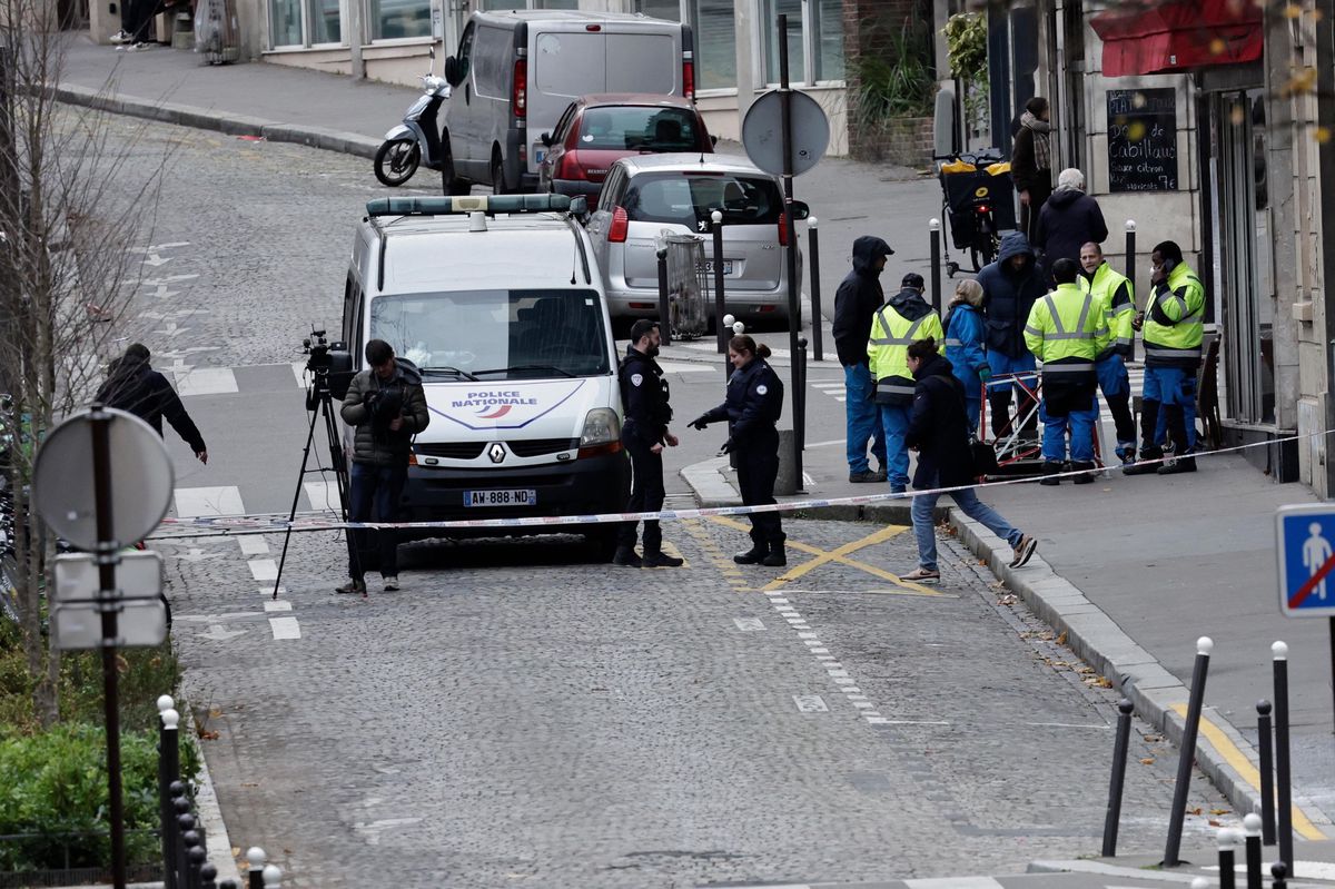Police officers stand outside the Rodin high school in the 13th arrondissment of Paris after a teenager was killed during a brawl between rival gangs, in December 17, 2024. (Photo by STEPHANE DE SAKUTIN / AFP)
