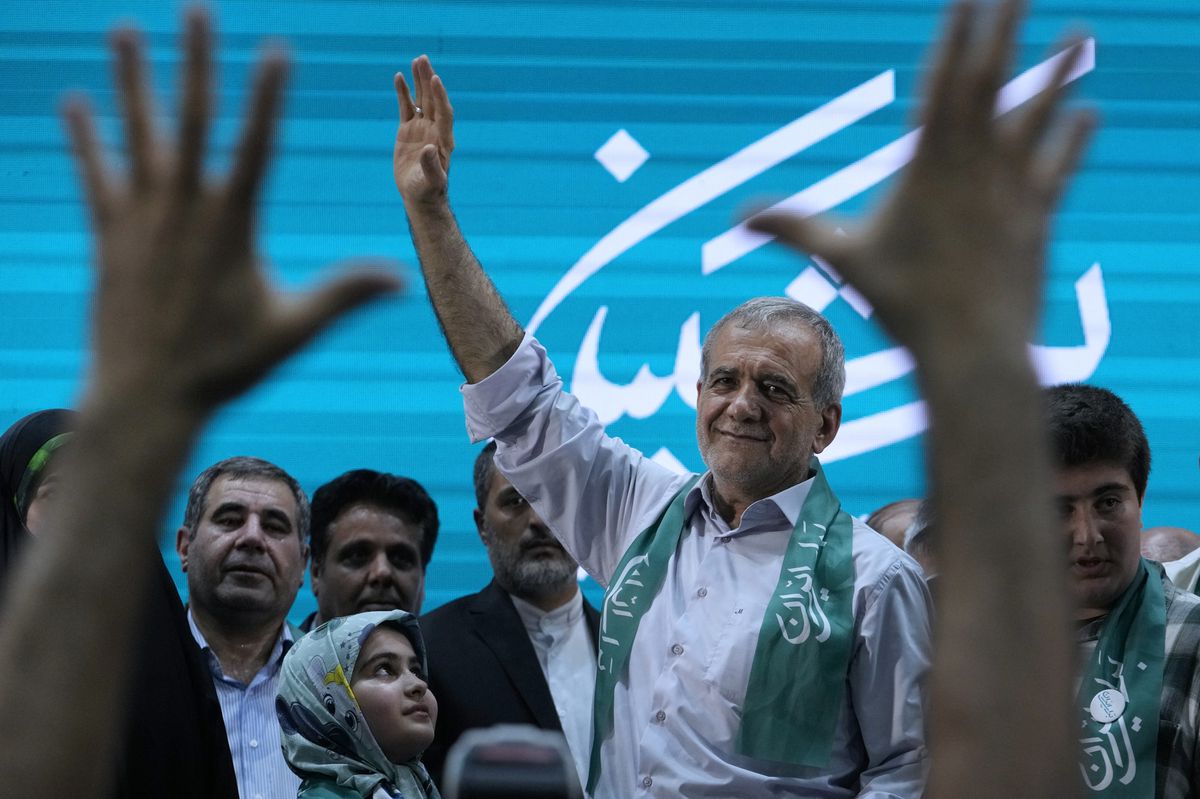 Reformist candidate for Iran's June 28, presidential election Masoud Pezeshkian waves to his supporters in a campaign meeting in Tehran, Iran, Sunday, June 23, 2024. Iran's Guardian Council has approved six candidates to run in the election to replace the late President Ebrahim Raisi, who was killed in a helicopter crash with seven other officials in May. (AP Photo/Vahid Salemi)
Masoud Pezeshkian
