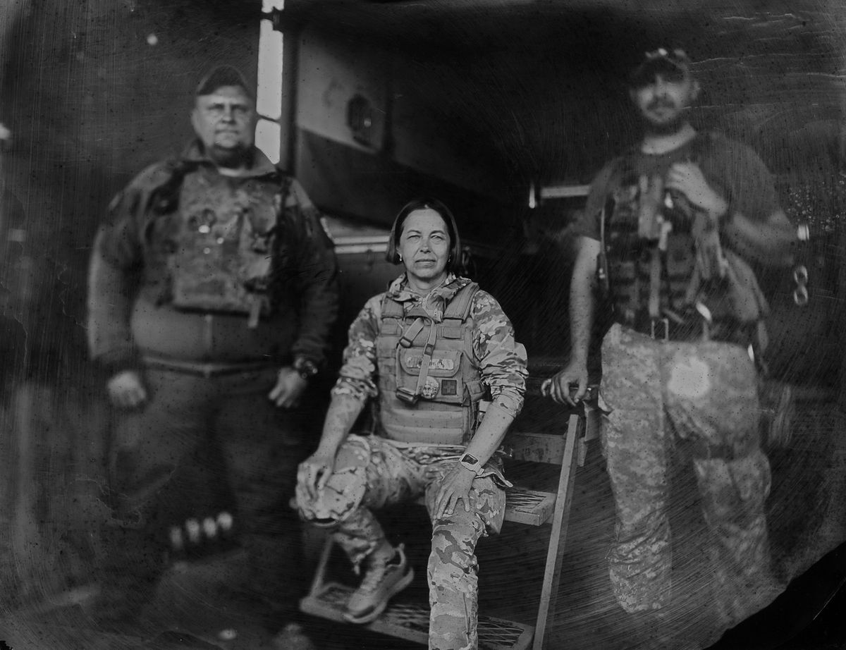 Natalie, paramedic of 80 brigade, with her colleagues, at evacuation point